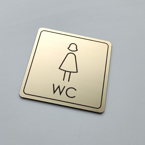 zlatý piktogram WC dámy