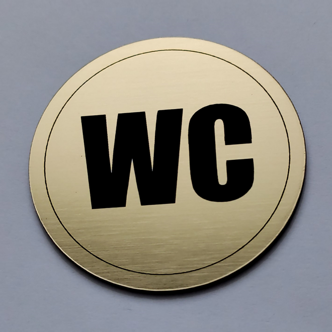 okrúhla zlatá tabuľka WC